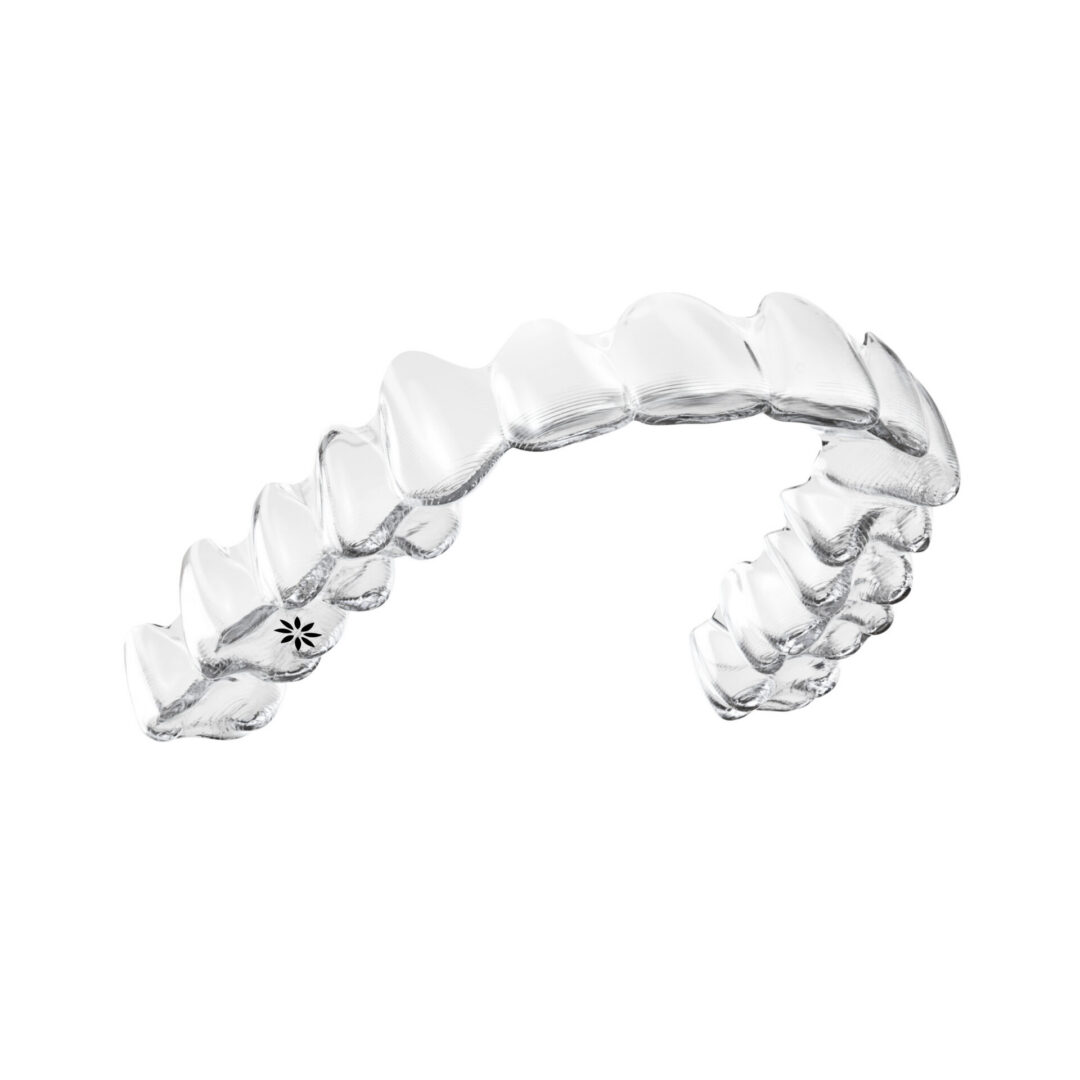 Clear dental aligner on white background.